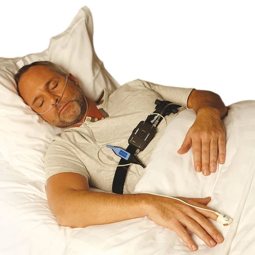 Patient undergoing a sleep study test with sensors and nasal cannula